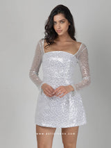 Λευκό φόρεμα με ασημένιες παγέτες, διαφανή μανίκια & κορδέλα