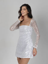 Λευκό φόρεμα με ασημένιες παγέτες, διαφανή μανίκια & κορδέλα